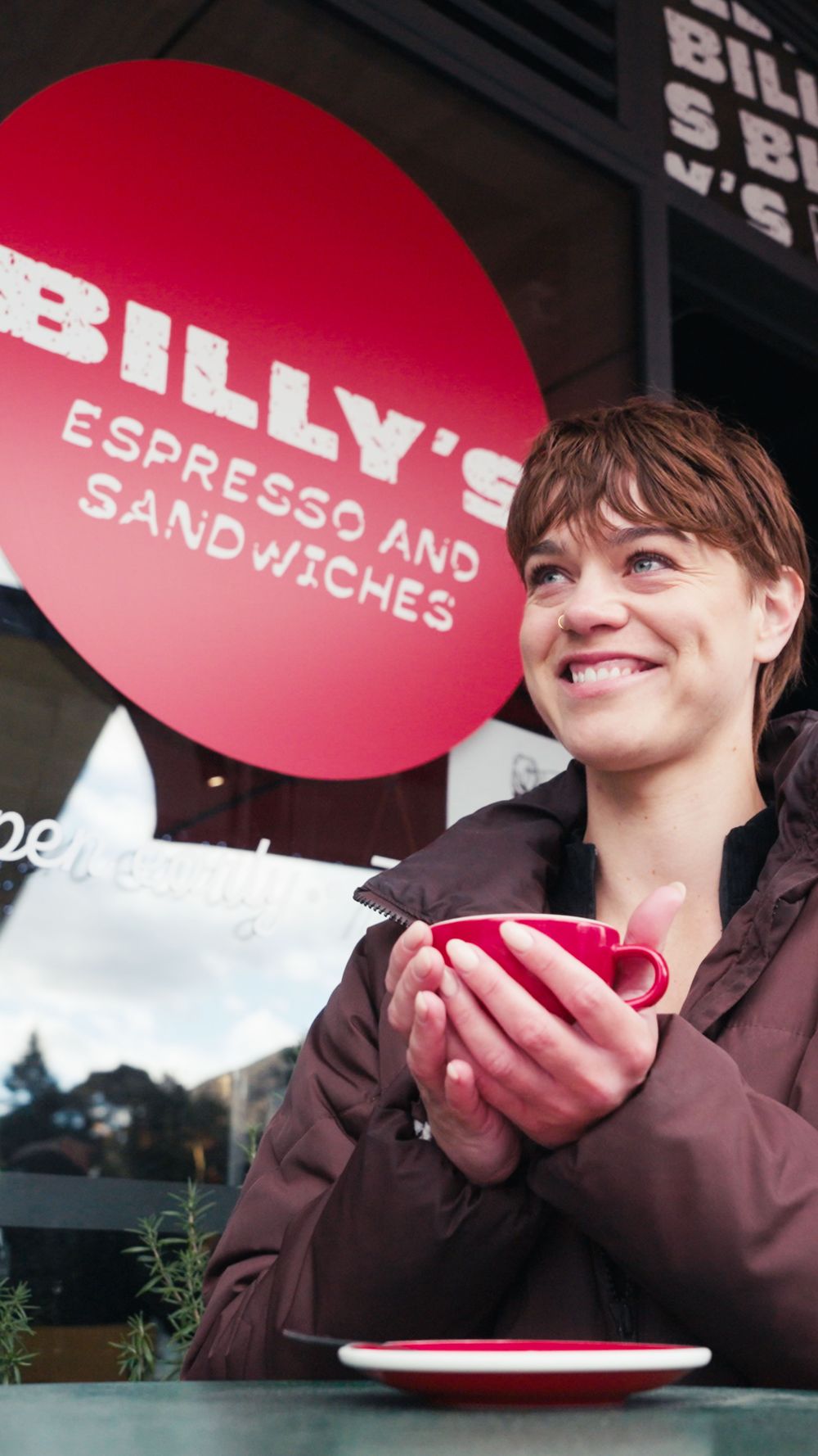Warming up with a coffee outside Billy's Espresso