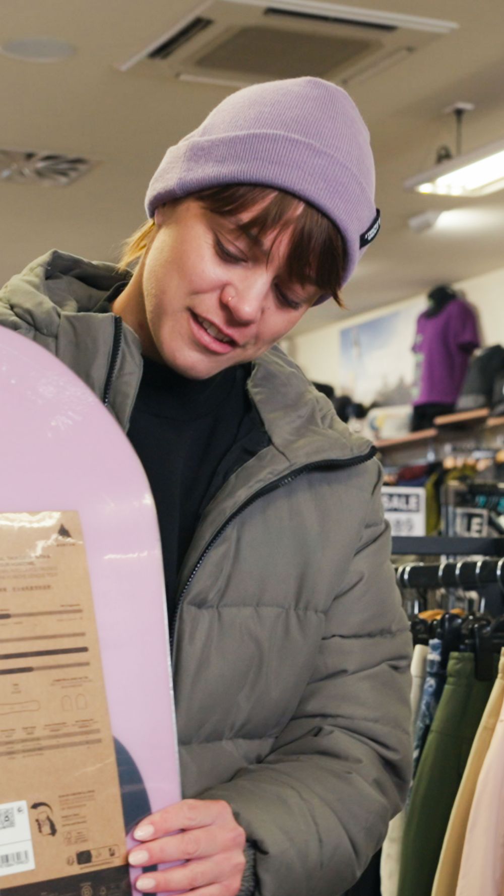 Trying on a beanie in an outdoor store