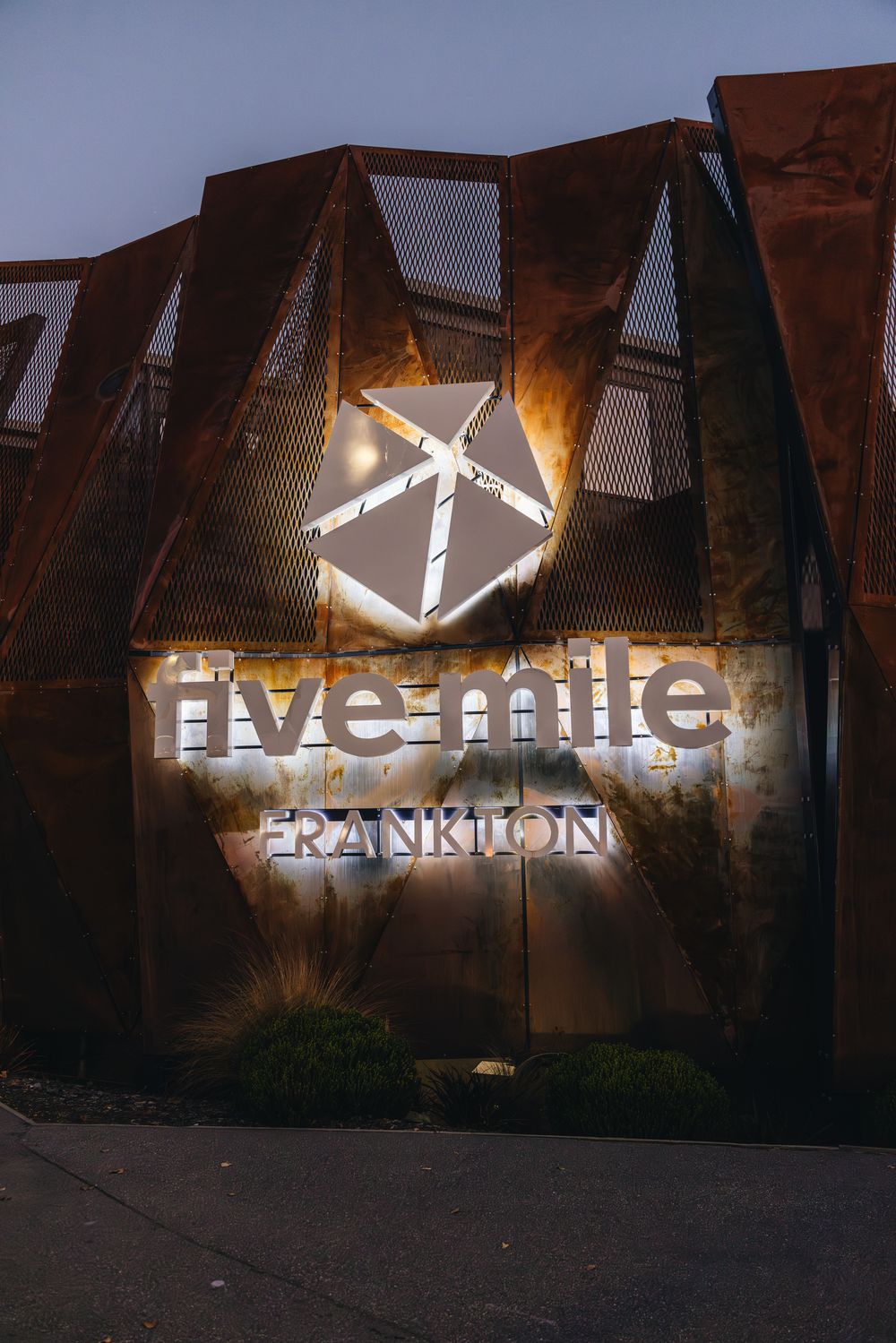 The Five Mile sign lit up at dusk